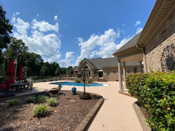 HOA Backyard Pool. Rubber surfacing is installed throughout.