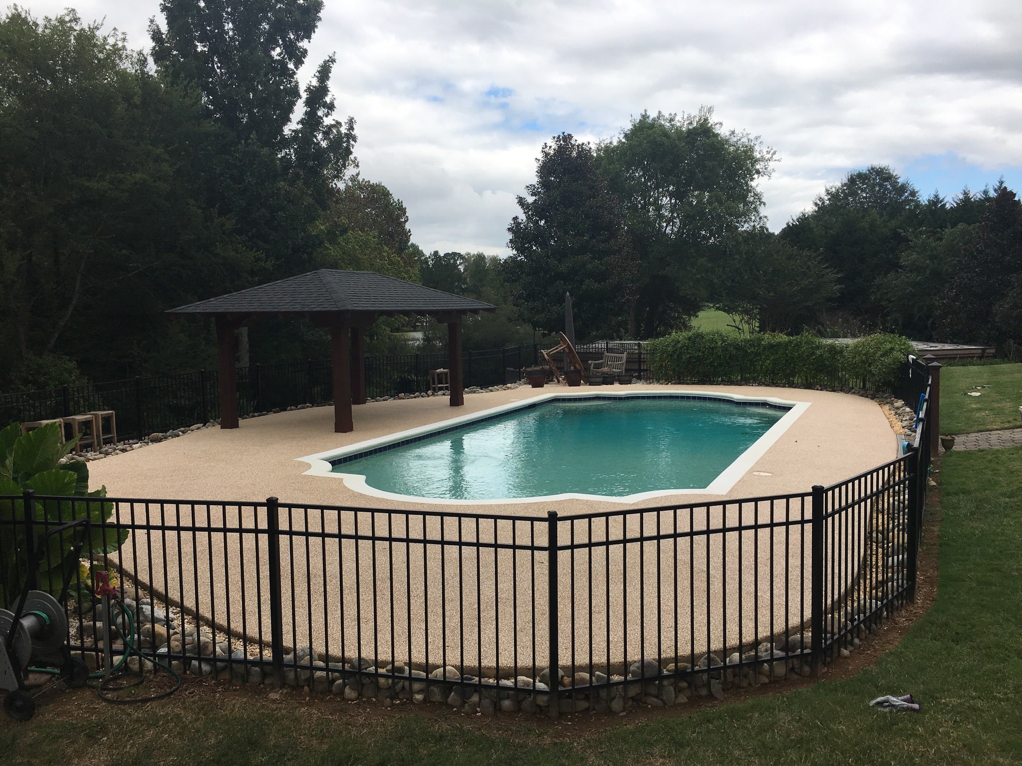 Residential Pool Deck with rubber surfacing - in-ground pool 