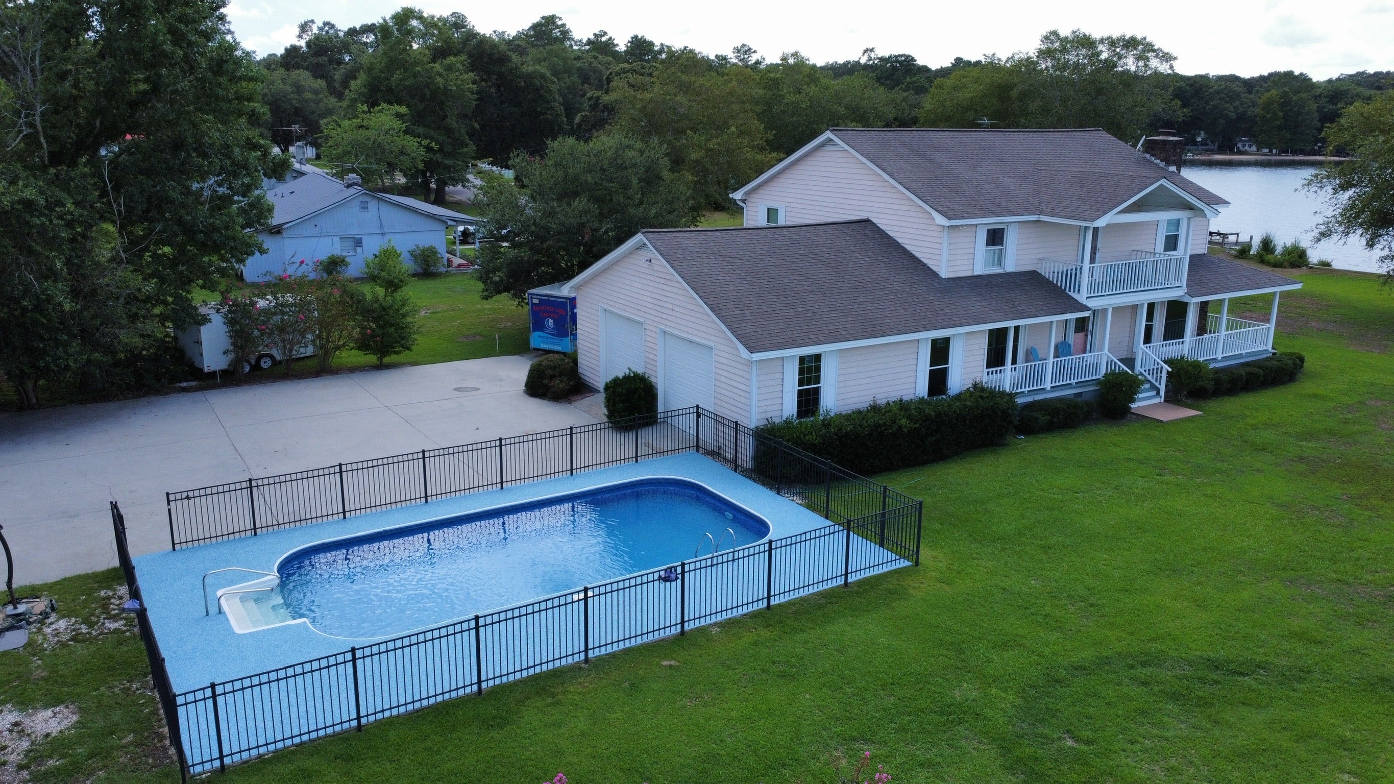 Residential Pool deck - with rubber surfacing - Underground Pool - Beautiful home with lake in the distance